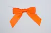 3" X 2-3/4" SATIN ORANGE PRE-TIED BOW CLEAR TWIST TIE