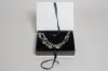 7X5-1/2X1-1/4 MATTE WHITE W/ BLACK PLATFORM AND RIBBON JEWELRY BOX